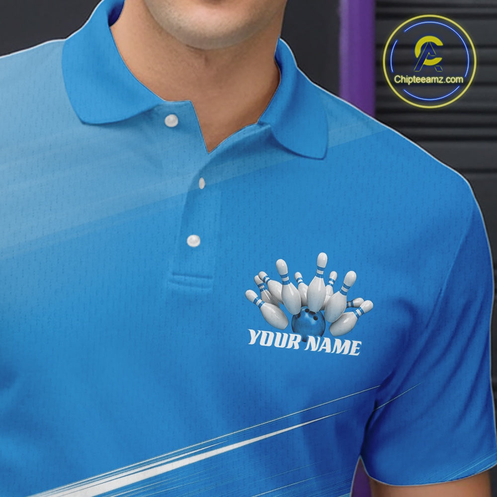Close up left chest view of a blue bowling polo shirt with bowling ball and pins motif over a pink geometric pattern.