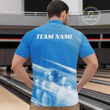 Load image into Gallery viewer, Male model front view in a bowling lane wearing a blue bowling quarter zip shirt with bowling ball and pins geometric graphics.