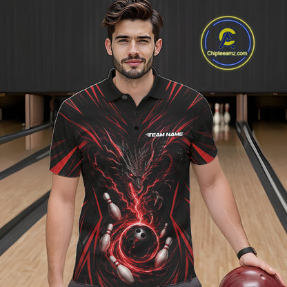 A man wearing a black short-sleeve polo shirt with a red and black bowling-themed graphic print, standing in a bowling alley holding a bowling ball. 