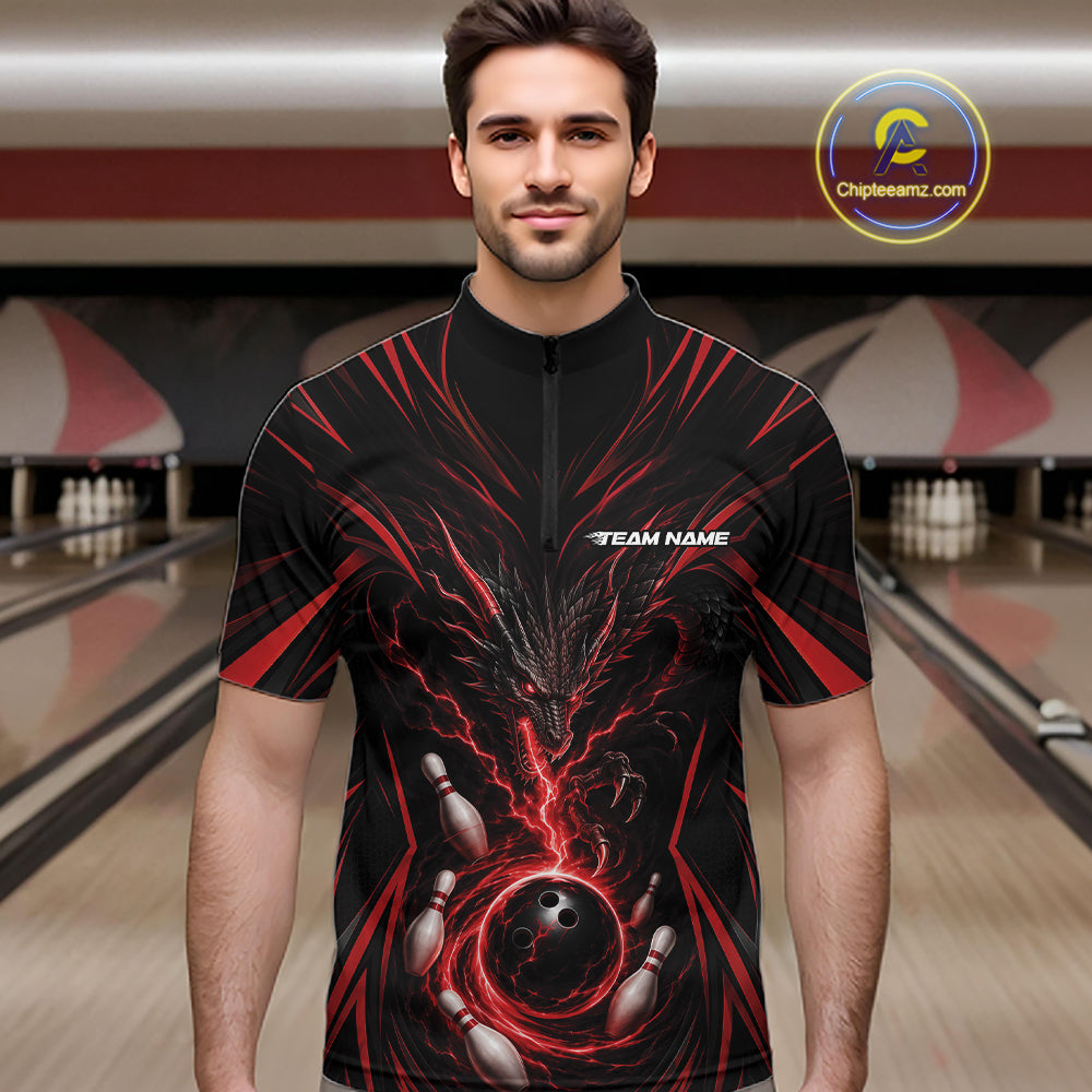 A man wearing a black short-sleeve zip-up bowling jersey with a red and black dragon with bowling pins and a bowling ball on the front. 