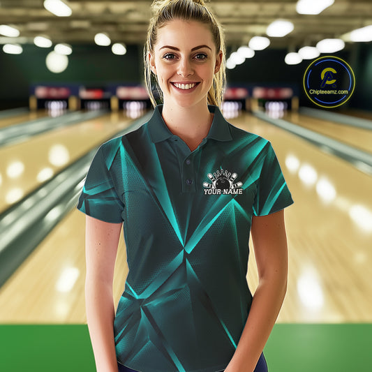 Woman wearing a teal bowling shirt with a logo in a bowling alley