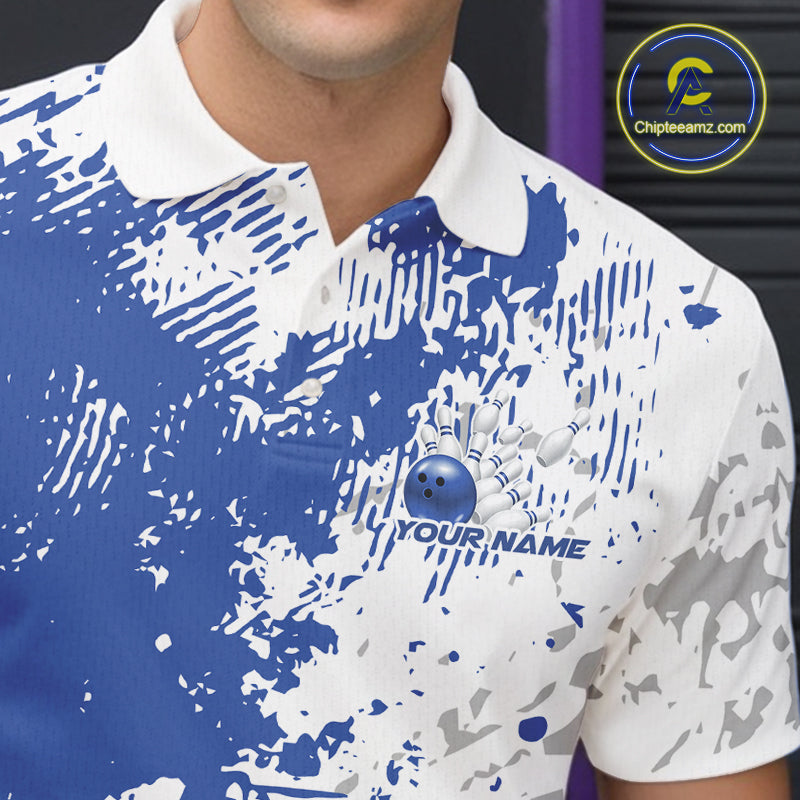 Close-up view of the left chest of a blue and white splatter bowling polo shirt showing abstract sporty bowling pattern detail.
