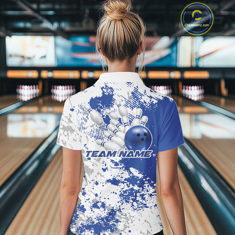 Back view of a female model in a bowling lane wearing a bowling quarter-zip shirt featuring blue and white splatter pattern with modern athletic styling.