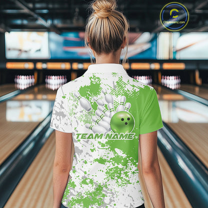 Back view of a female model in a bowling lane wearing a green and white splatter bowling quarter-zip shirt with simple sporty bowling graphics.
