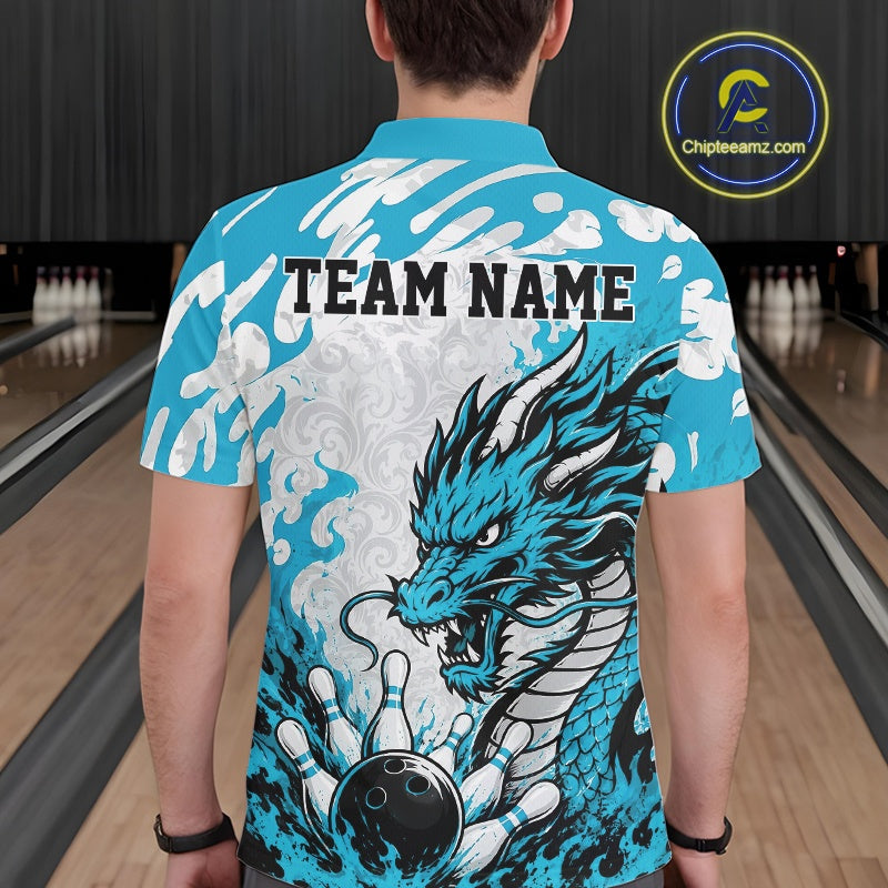 Person wearing a blue bowling shirt with a dragon design and 'TEAM NAME' text at a bowling alley.