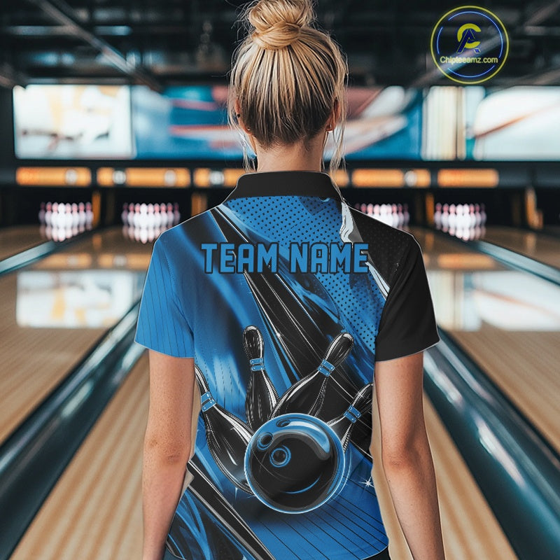 Back view of a female model in a black and blue bowling quarter-zip shirt featuring a bowling ball striking pins with dynamic speed streak graphics.