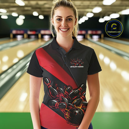 Female model front view in bowling lane wearing black and red polo shirt with flaming bowling ball hitting pins in powerful sports motion scene.