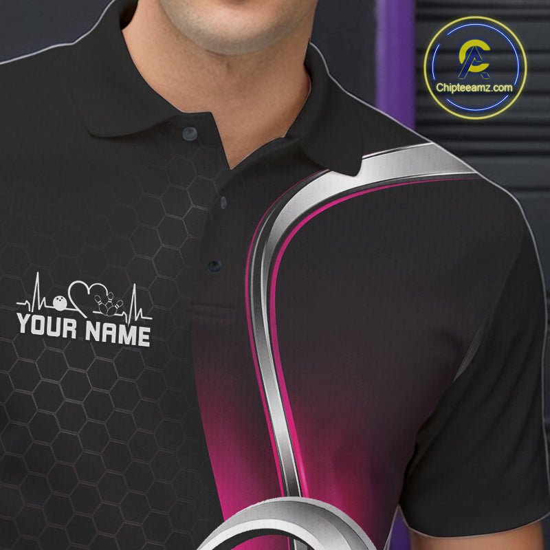 Close-up of the left chest area of a black and pink bowling polo shirt, featuring honeycomb texture and a heart-shaped bowling ball and pins graphic.