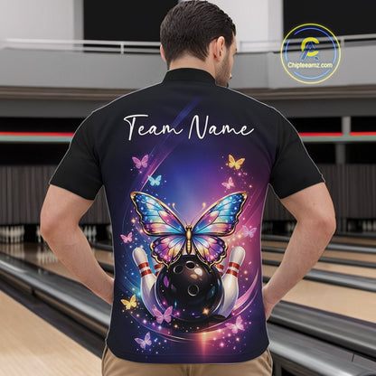 Front view of a male model in a bowling venue wearing a colorful quarter-zip shirt featuring luminous butterflies and bowling-themed graphics.