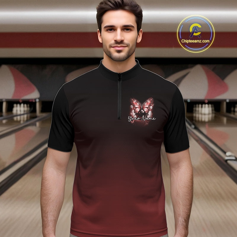 Male model at a bowling lane wearing a red bowling quarter-zip shirt with glowing butterfly artwork and a cosmic bowling theme.