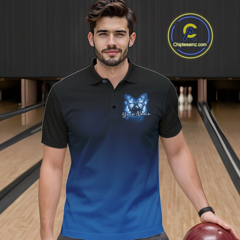 Male model at a bowling lane wearing a blue bowling polo shirt with glowing butterflies, a bowling ball centerpiece, and fallen pin graphics.
