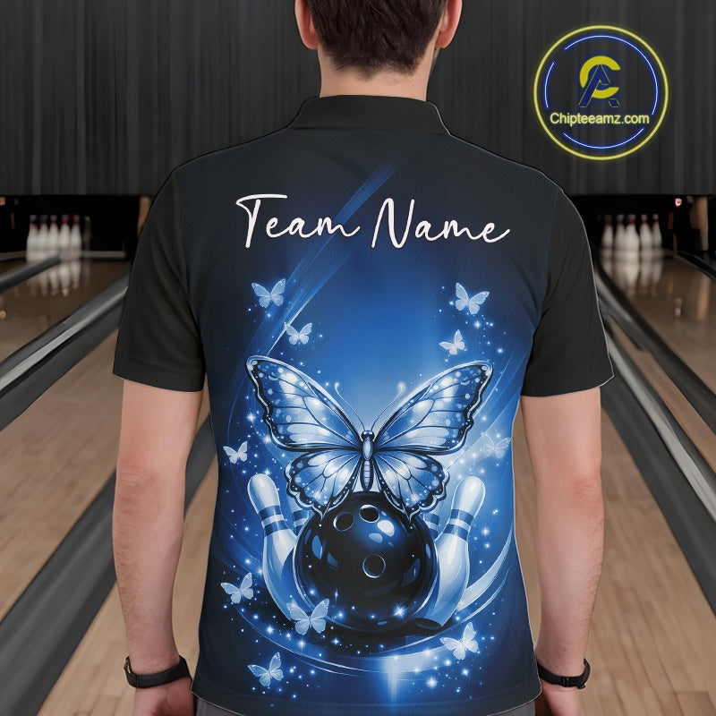 Back view of a male model in a bowling venue wearing a blue polo shirt showcasing luminous butterflies and a cosmic bowling theme.