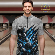 Load image into Gallery viewer, Front view of a male model wearing a gray bowling quarter zip shirt featuring a dramatic blue bowling ball and pins graphic with bold claw-mark artwork in a bowling lane.
