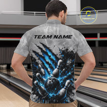 Load image into Gallery viewer, Front view of a male model wearing a gray bowling quarter zip shirt featuring a dramatic blue bowling ball and pins graphic with claw-mark artwork in a bowling lane.