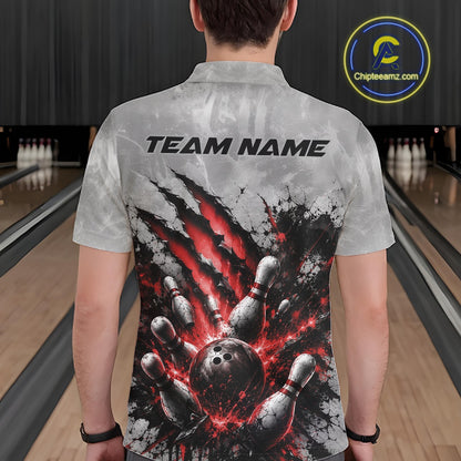 Back view of a male model wearing a gray bowling polo shirt with a dramatic red bowling ball and pins graphic accented by claw-mark artwork in a bowling lane.