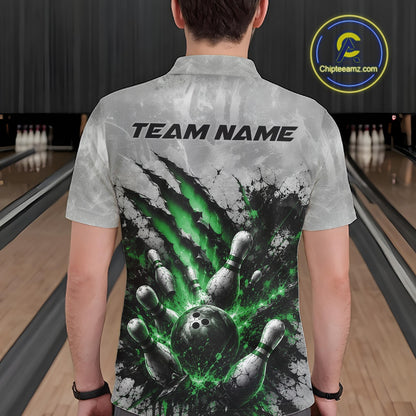 Back view of a male model wearing a gray bowling polo shirt showcasing a dramatic green bowling ball striking pins graphic with claw-mark artwork in a bowling lane.