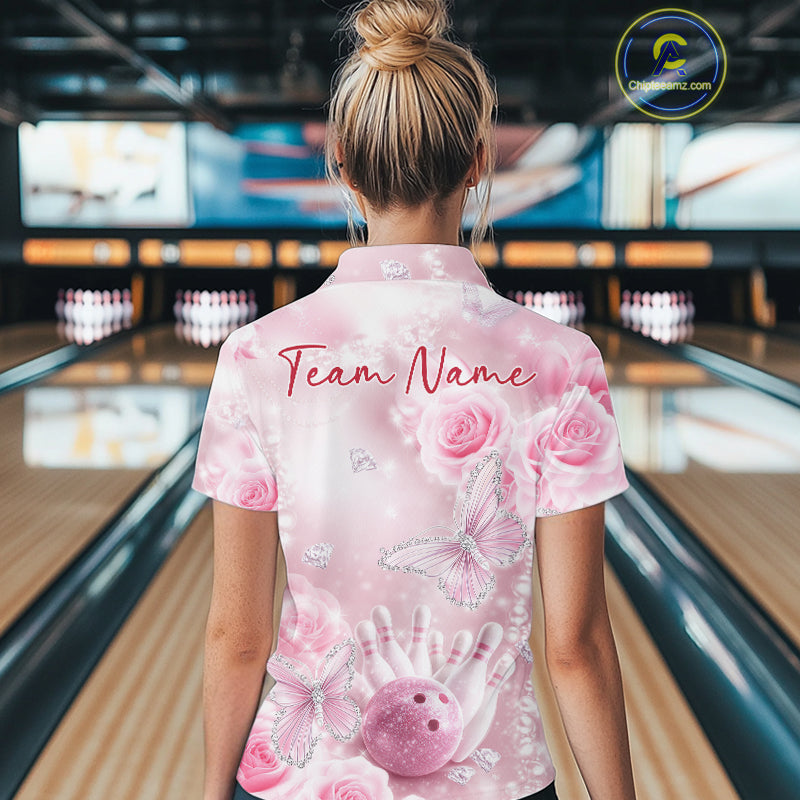 Back view of a female model wearing a women’s bowling quarter-zip shirt with sparkling butterfly artwork, roses, bowling pins, and bowling ball accents.