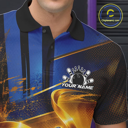 Close-up of the left chest on a bowling polo shirt featuring a glossy blue bowling ball and pins wrapped in flowing metallic gold ribbons.
