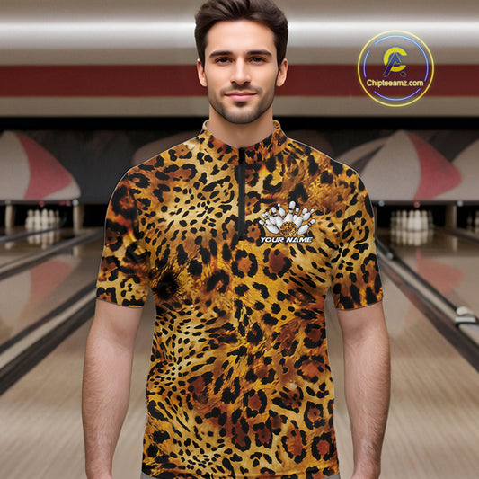 Man in a bowling alley wearing a leopard print men's quarter zip shirt with a customizable text

