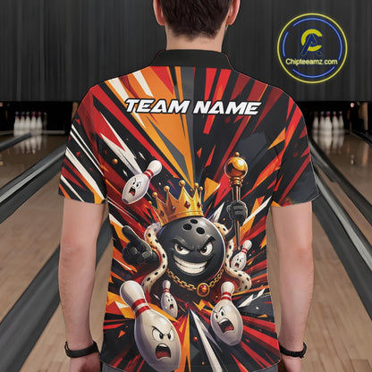 Back view of a male model wearing a black, red, and orange bowling polo shirt showcasing a crowned cartoon bowling ball with a royal scepter leading animated bowling pins through vibrant bursts of color in a bowling lane.