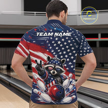 Load image into Gallery viewer, Front view of a male model wearing a bowling quarter zip shirt with artwork of a patriotic raccoon, a red, white, and blue bowling ball striking pins, and a flowing American flag at a bowling lane.
