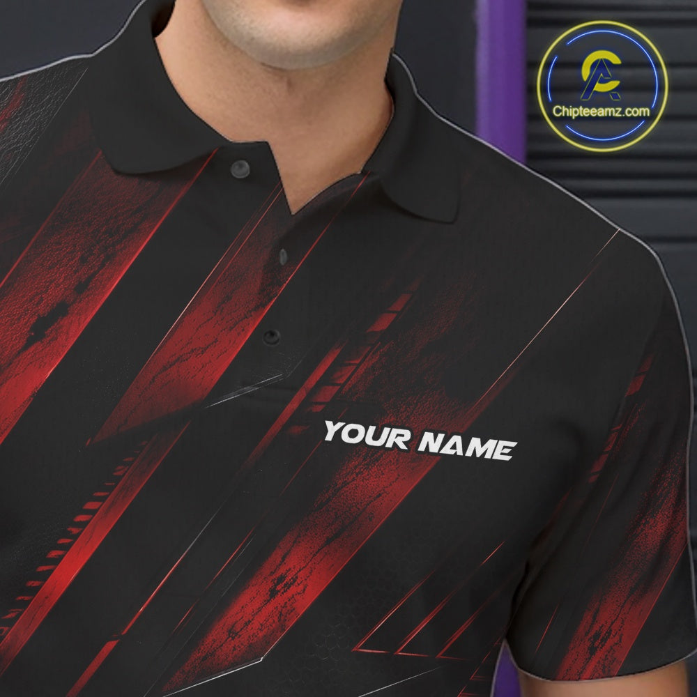 Close-up of the left chest on a black and red bowling polo shirt featuring festive cartoon bowling balls and pins raising frothy beer mugs with confetti and bold diagonal stripe accents.