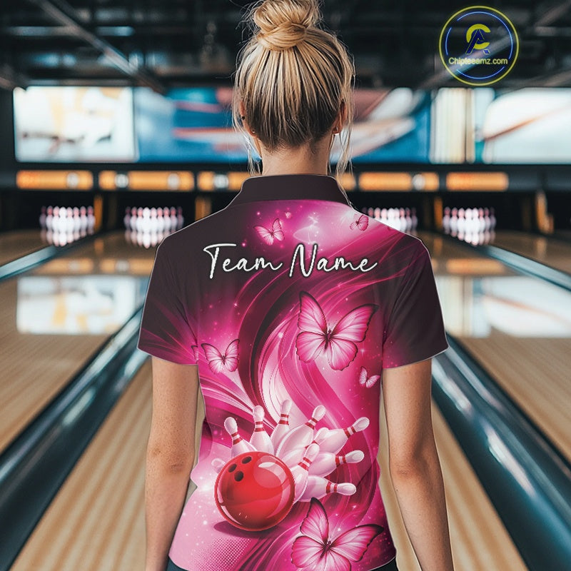Back view of a pink womens bowling polo showcasing a bowling strike scene with butterfly accents.
