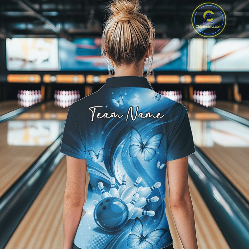 Back view of a blue quarter-zip bowling shirt with bowling ball, pin, and butterfly graphics.