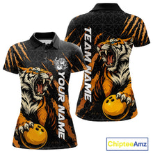 Load image into Gallery viewer, Front and back view of a black and yellow women's bowling polo shirt showcasing a roaring tiger holding a yellow bowling ball with orange claw-stripe artwork and a geometric background pattern.
