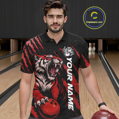 Front view of a male model in a bowling lane wearing a black and red bowling polo shirt featuring a roaring tiger holding a red bowling ball with red claw-stripe graphics and a geometric background pattern.