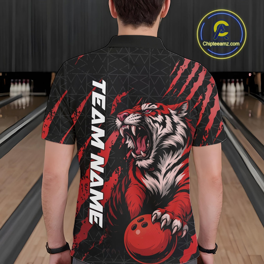 Back view of a male model wearing a black and red bowling polo shirt in a bowling lane, featuring a roaring tiger holding a red bowling ball with red claw-stripe artwork and a geometric background pattern.