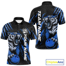 Load image into Gallery viewer, Front and back view of a black and mid blue men's bowling polo shirt showcasing a roaring tiger holding a mid blue bowling ball with matching claw-stripe artwork and a geometric background pattern.