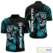 Load image into Gallery viewer, Front and back view of a black and teal blue men's bowling quarter-zip shirt featuring a roaring tiger holding a teal blue bowling ball with teal blue claw-stripe artwork and a geometric background pattern.