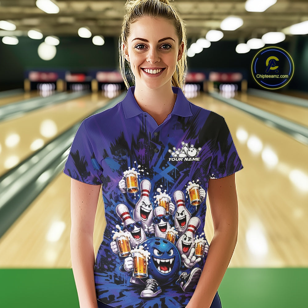 Front view of a female model at a bowling lane wearing a blue and purple bowling polo shirt decorated with playful artwork of funny bowling pins and a bowling ball holding frothy beer mugs.