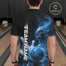 Load image into Gallery viewer, Back view of a male model in a bowling alley wearing a black bowling polo shirt featuring a blue fiery skull design with lightning striking a bowling ball and pins and a custom name.
