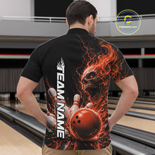 Load image into Gallery viewer, Front view of a male model in a bowling alley wearing a black bowling quarter zip shirt featuring an orange fiery skull with lightning striking a bowling ball and pins and a custom name.
