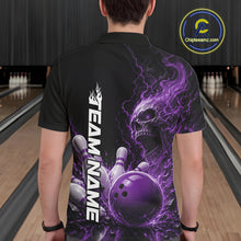 Load image into Gallery viewer, Back view of a male model in a bowling alley wearing a black bowling polo shirt featuring a purple fiery skull design with lightning striking a bowling ball and pins and a custom name.
