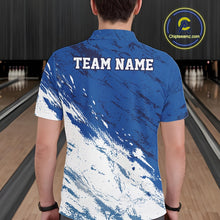 Load image into Gallery viewer, Back view of a male bowler wearing a white and blue bowling polo shirt with a splatter inspired sports jersey pattern in a bowling alley