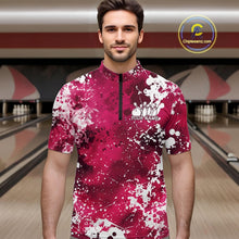 Load image into Gallery viewer, Front view of a male model in a bowling alley wearing a bowling polo shirt featuring a white paint splatter design on a pink shirt.
