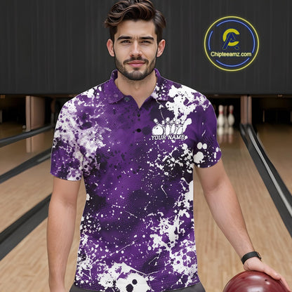 Front view of a male model in a bowling alley wearing a purple bowling polo shirt featuring a white paint splatter sportswear design.
