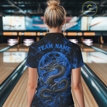 Load image into Gallery viewer, Back view of a female model in a bowling alley wearing a blue custom bowling polo shirt featuring an ancient dragon, flames, and a moon-inspired bowling ball design.