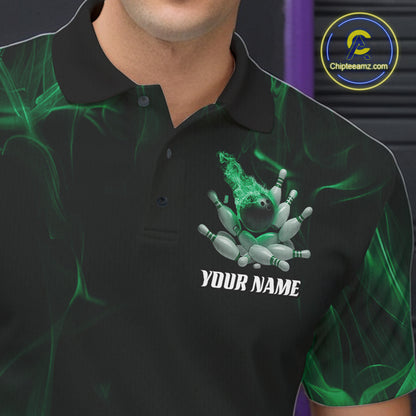Male model at a bowling lane wearing a black and green bowling polo shirt with scattered pins and fiery bowling action design.