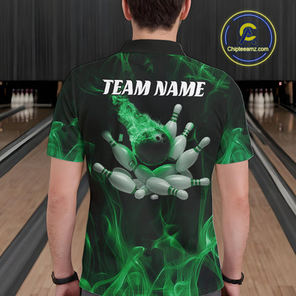 Back view of a male model in a bowling alley wearing a black and green polo featuring bowling ball impact graphics and flame effects.