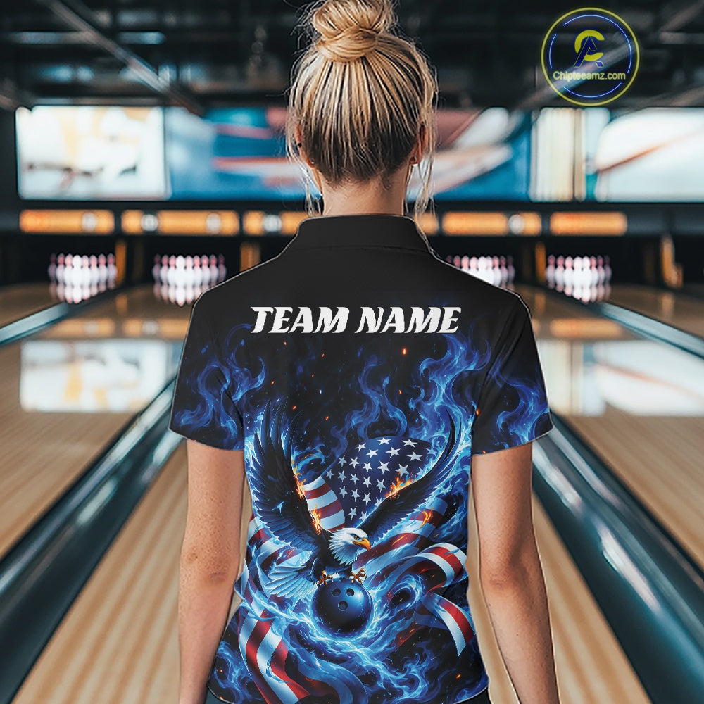 Back view female model in a bowling lane wearing a bowling polo shirt with flaming bald eagle, blue bowling ball, flag details, and blue flames.