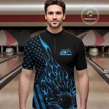 Male model wearing a black bowling quarter-zip shirt at a bowling lane with blue flame bowling strike artwork and patriotic graphics.