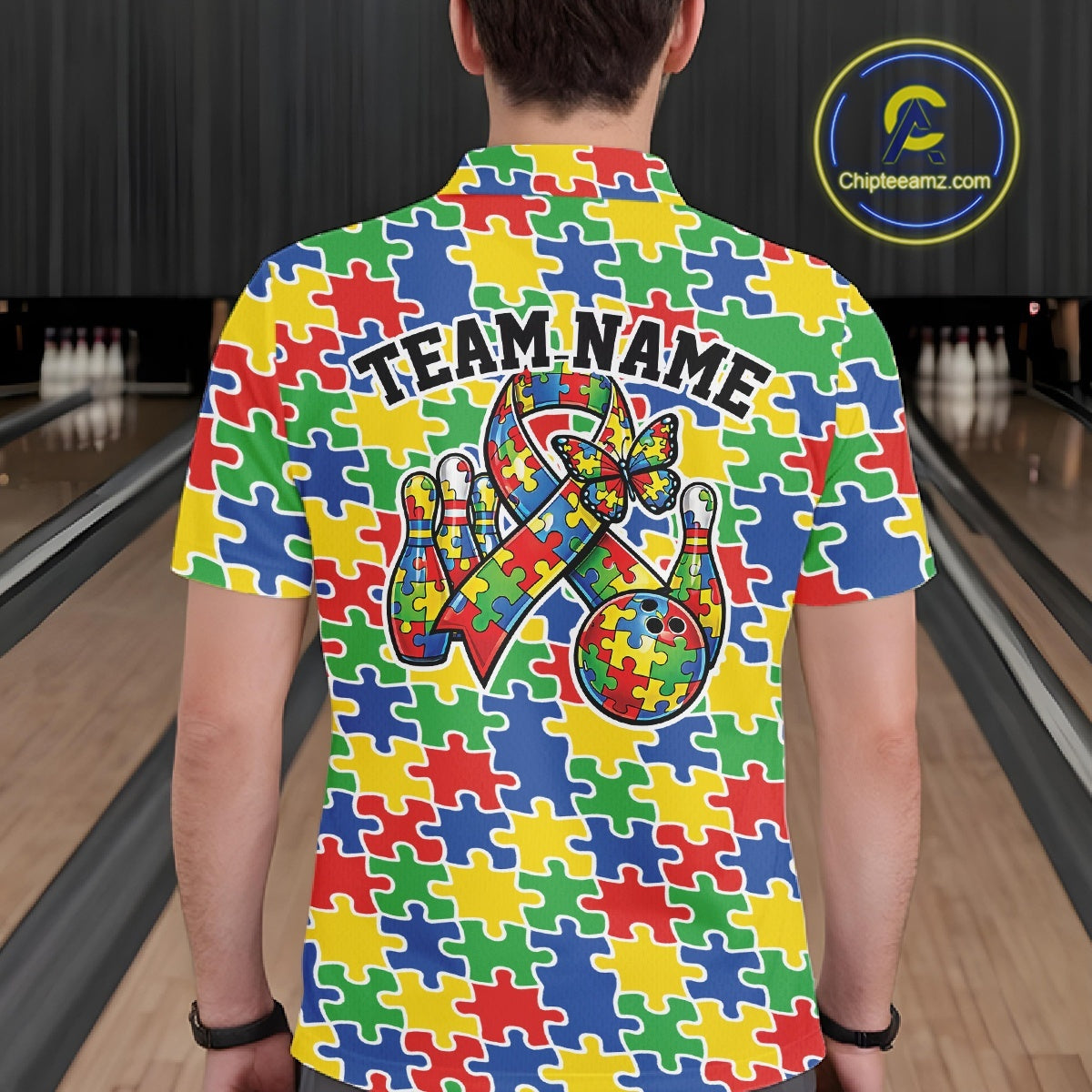 Male model at a bowling lane, back view of colorful polo shirt showcasing seamless puzzle piece print across the fabric