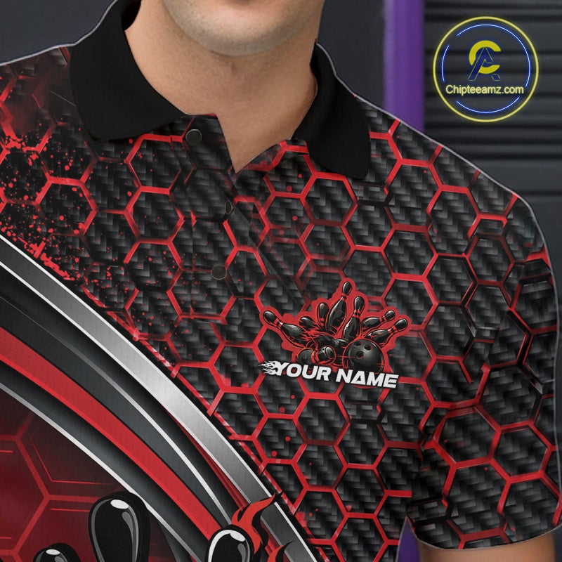 Close-up of the left chest area of a black and red bowling polo shirt, featuring honeycomb design with a flaming bowling ball hitting pins.