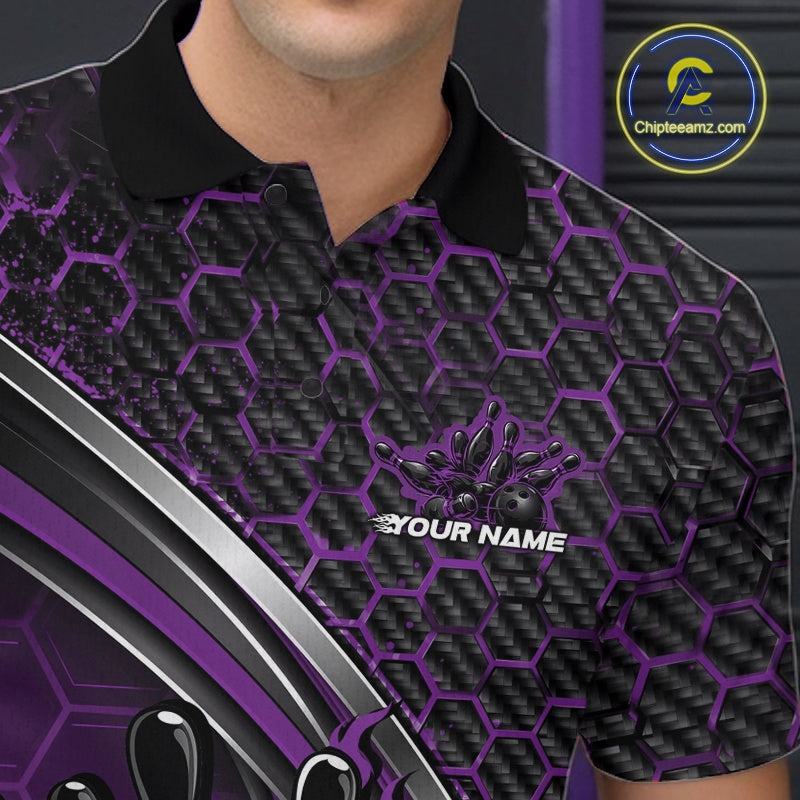 Close-up of the left chest area of a black and purple bowling polo shirt, featuring honeycomb pattern and a flaming bowling strike design.