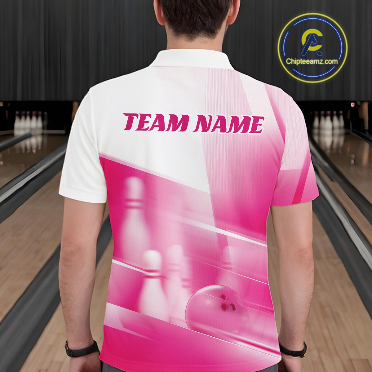 Back view of a male model in a bowling lane wearing a white and pink polo shirt with bowling ball and pins geometric artwork.