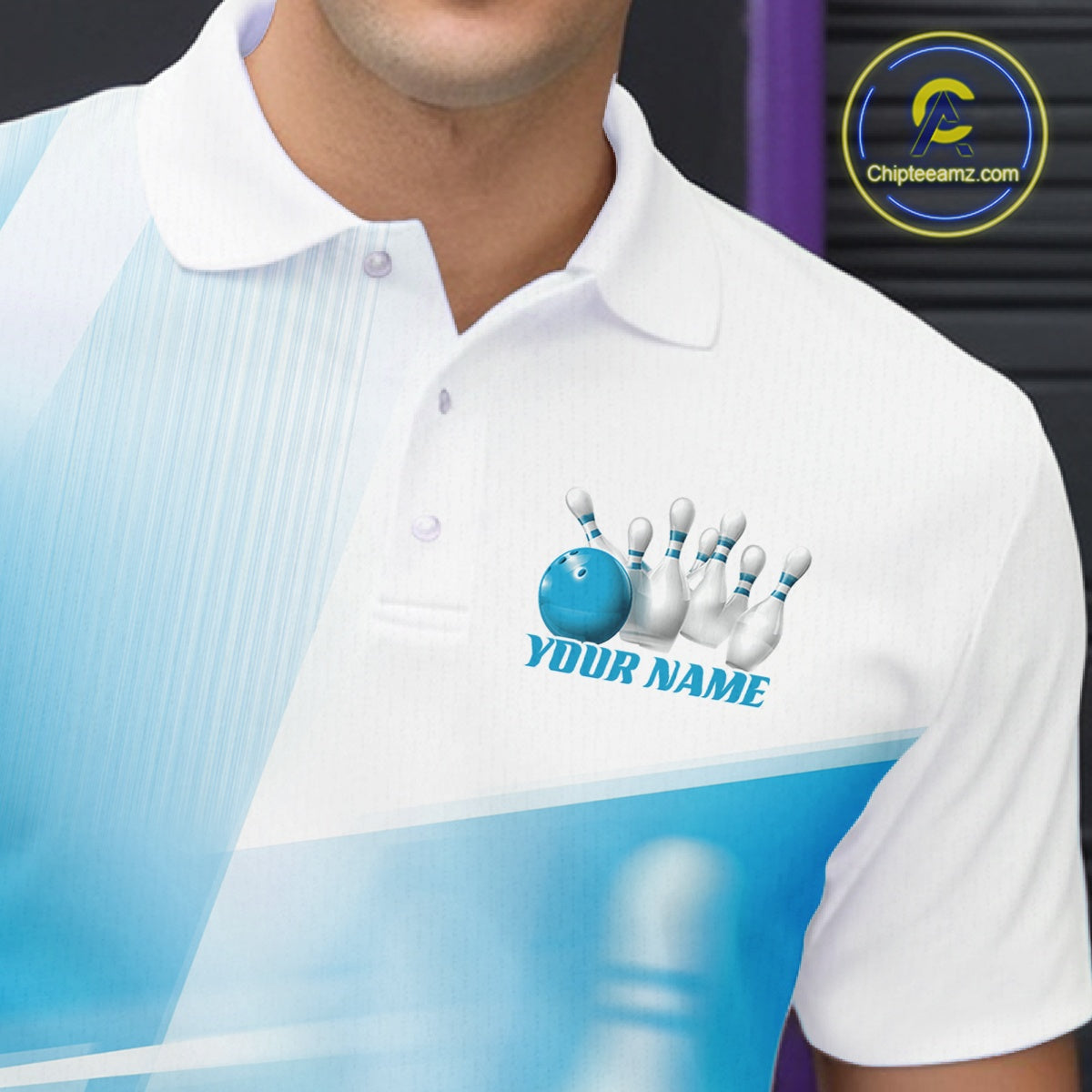 Close up left chest view of a white and blue bowling polo shirt with bowling ball and pins blended into a pink geometric pattern.